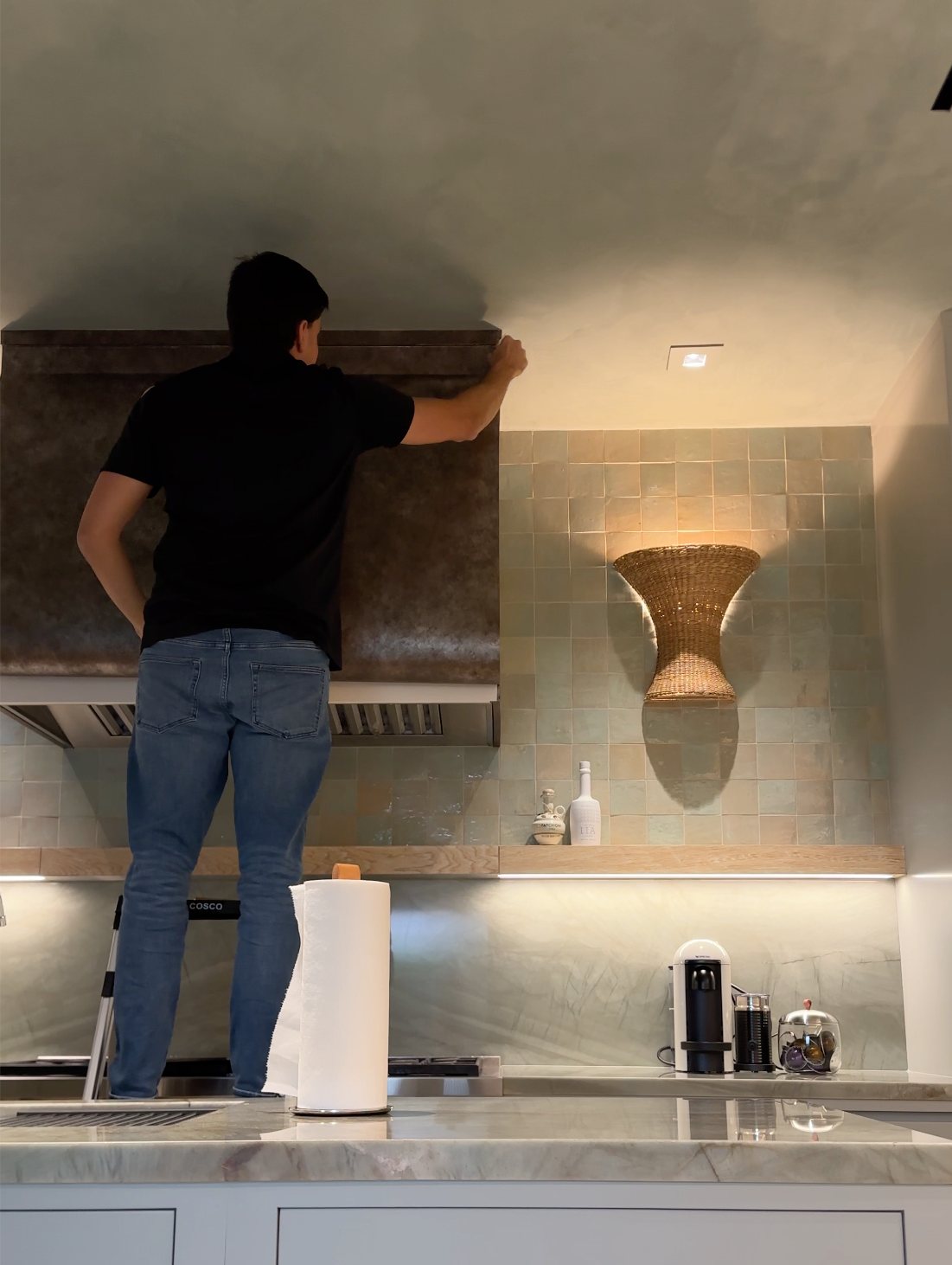 KWD Certified Installer wrapping a range hood